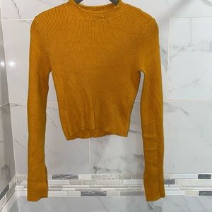 High Neck Ribbed sweater with slits in the sleeve